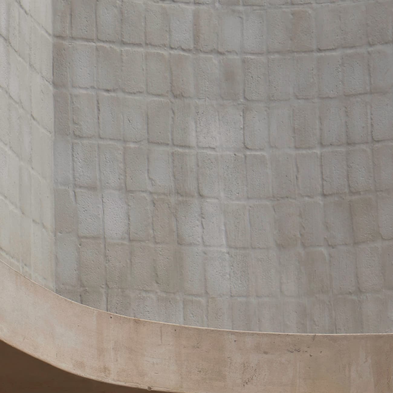 Curved plaster wall in soft daylight
